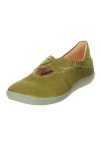 Olive green suede shoe with cross strap, rounded toe, and a translucent sole. Features a smooth texture and minimalistic design.