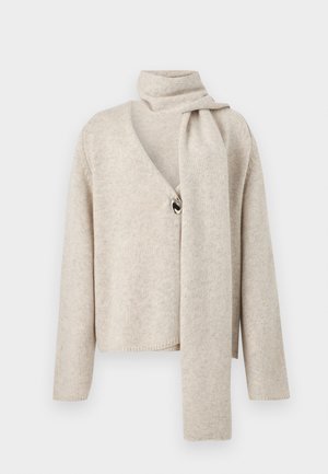 Beige knit cardigan with long sleeves, V-neck, single large button closure, and attached scarf draped over the shoulder.