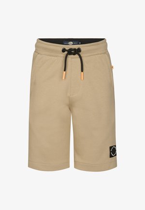 Pantaloni scurți bej din material de trening cu talie elastică și șnur negru, având accente portocalii și o etichetă cu logo pe lateral. Textură netedă a materialului.