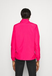 Rosa leichte Jacke mit hohem Kragen, elastischen Bündchen und glatter Textur. Der Rücken ist schlicht gehalten mit einem geraden Saum.