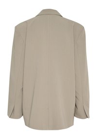 Übergroßer beiger Blazer mit glatter Textur, Reverskragen und subtilem Nadelstreifenmuster. Mit weiten Ärmeln und lockerer Passform versehen.