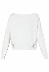 Maglione bianco corto con maniche lunghe. Presenta dettagli metallici sui lati e un ampio scollo. Realizzato in morbido tessuto a maglia.