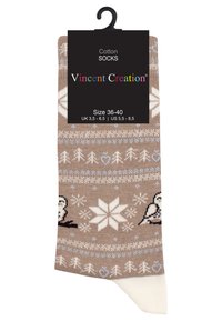 Cotton socks in brown with winter-themed patterns, featuring white snowflakes and birds, size label attached at the top, with a beige cuff.