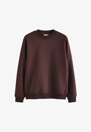 Brun, rundhalsad sweatshirt tillverkad av slätt tyg. Har ribbade manschetter och fåll, med en avslappnad passform och minimalisk design.