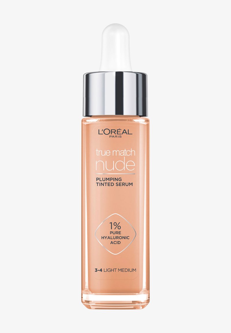 Buteleczka serum tonującego L'Oréal True Match Nude z aplikatorem kroplowym, odcień 3-4 Light Medium, zawiera 1% czystego kwasu hialuronowego.