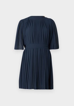 Navy pleated dress with short, sheer sleeves, a high neckline, and a belted waist; features a gold accent at the shoulder.