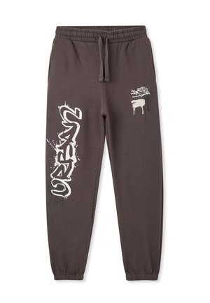 Pantaloni grigi in felpa con elastico in vita, caratterizzati da disegni in stile graffiti bianchi sui lati e gamba affusolata. Materiale misto cotone.
