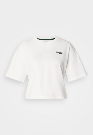 Balta trumpa medvilninė palaidinė, suapvalintu kaklu ir trumpomis rankovėmis. Kairėje krūtinės pusėje žalia siuvinėta logotipas. Lygus audinys.