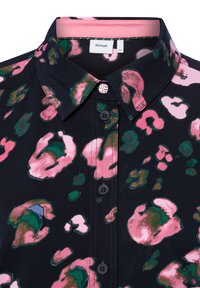 Collared shirt featuring a black base with pink and green abstract leopard print, two dark buttons, and a pink inner collar lining.