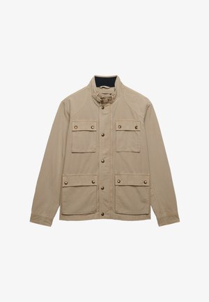 Beige casual jacket with high collar, button front closure, and four flap pockets with button details on front.
