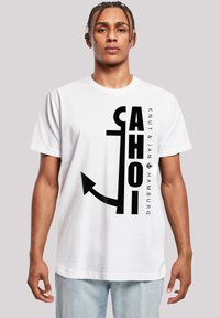 White cotton t-shirt featuring a bold black graphic design with the word "AHOI" and an anchor motif, alongside the text "KNUT & JAN HAMBURG."