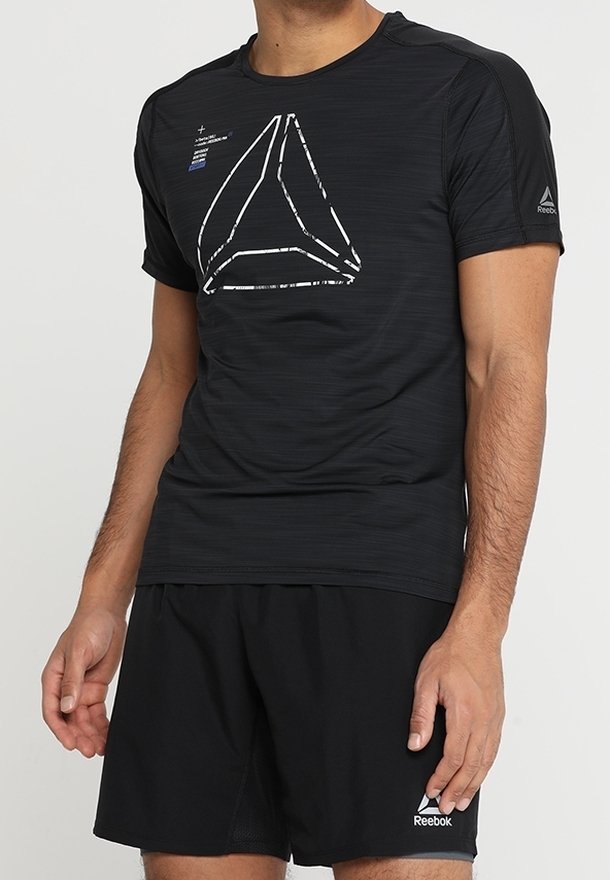 Black athletic t-shirt with a textured finish, featuring a white geometric logo on the front and short sleeves. Paired with black shorts.