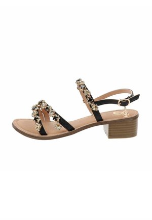 Sandalini neri con cinturini decorati da strass, tacco a blocco, soletta imbottita e cinturino alla caviglia regolabile. Suola piatta con leggera texture.