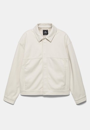 Off-white langærmet jakke med krave, forlommer og skjult lynlås foran, lagt fladt på en lys baggrund.