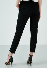 LELA REGULAR FIT - Hlače - black
