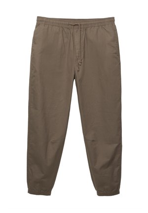 Pantaloni jogger leggeri di colore marrone con cintura elastica e cordino regolabile. Gamba affusolata con polsini elastici alle caviglie.