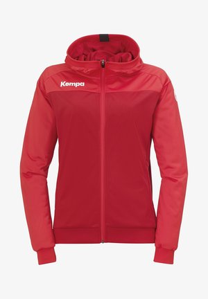 Punainen vetoketjullinen urheilutakki hupulla ja pitkillä hihoilla, jossa valkoinen Kempa-logo vasemmassa ylässä rintakehässä.