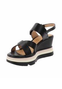 Sandali con zeppa nera e cinturini incrociati, materiale in pelle liscia, soletta color cuoio, suola intermedia a righe bianche e rosa, suola esterna nera texturizzata.