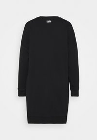 Vestito felpa nero con maniche lunghe, scollo rotondo e logo sul retro. Presenta una vestibilità rilassata e polsini e orlo a coste.