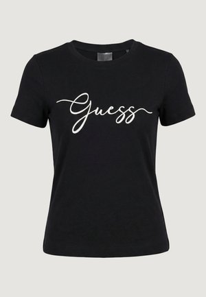 T-shirt noir à manches courtes avec le logo "Guess" blanc en cursive centré sur le devant, doté d'un col rond.