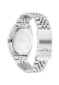 Edelstahlarmbanduhr mit einem runden Gehäuse, einem silberfarbenen Armband mit polierten und gebürsteten Gliedern sowie einem glatten, reflektierenden Boden.