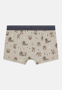 Beige boksertruser med robottrykk i brunt og hvitt, med et marineblått stripet elastisk midjebånd og et mykt, elastisk stoff.