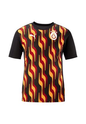 Maglietta nera a maniche corte con un audace motivo di fiamme in rosso, arancione e giallo. Presenta il logo Puma e un emblema circolare del club.