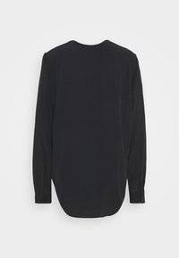 Schwarzes Langarmshirt aus glattem Stoff. Hat einen runden Ausschnitt, eine lockere Passform und geknöpfte Manschetten. Gerade Säume am Rücken.