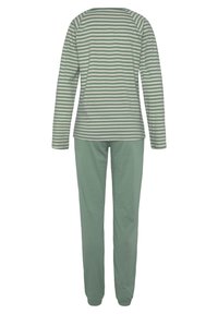 Zaļi un baltie svītraini garais piedurknes tops ar raglanu piedurknēm, apvienots ar zaļām biksēm. Mīksts kokvilnas audums, brīvs piegriezums, vienkāršs dizains.