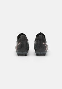 Puma FUTURE 7 PRO FG/AG JR UNISEX - Scarpe da calcio per terreni duri - black/white