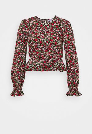Blusa a maniche lunghe con fantasia floreale, vita arricciata e polsini arricciati, con fiori rosa, rossi e bianchi su sfondo scuro.
