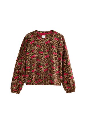 Brun tröja med leopardmönster och röda körsbär. Har långa ärmar och rundad halsringning. Mjukt tyg med en avslappnad passform.