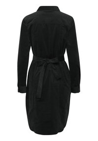 Robe en velours côtelé noir avec un col, des manches longues, une taille à nouer et des poignets avec boutons. Comprend un empiècement au dos et un ourlet droit.
