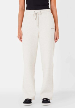 Lichtgrijze sweatpants met een trekkoord in de taille, relaxte pasvorm, zachte textuur en een klein geborduurd logo aan de zijkant.