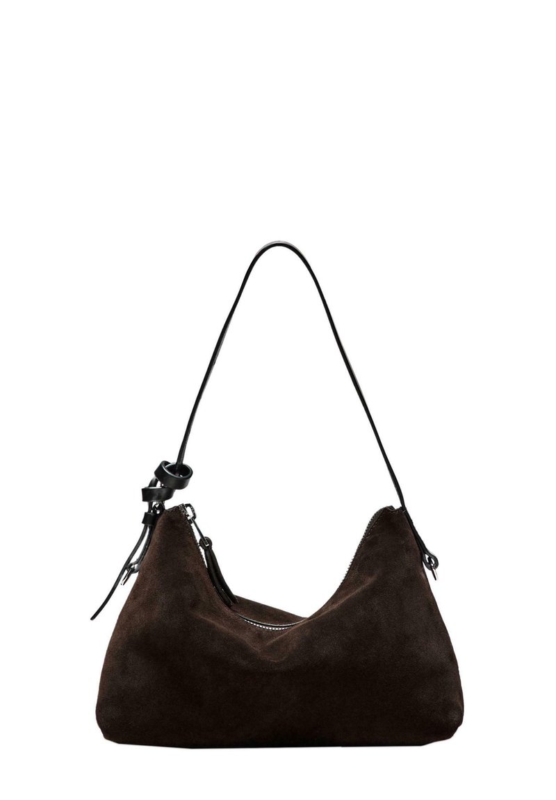 Brown suede shoulder bag with a curved shape, black leather strap, and zip closure. Features a smooth texture and minimalist design.