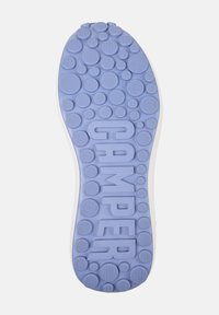 Shoe sole in light purple rubber, featuring circular patterns and the word "CAMPer" embossed in the center. Textured with various bubble shapes.