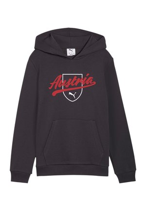 Czarna bluza z kapturem i kieszenią z przodu, z białą konturowaną tarczą oraz czerwonym napisem "Austria" nad białym logo Puma wewnątrz tarczy.