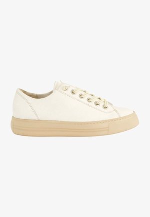 White canvas sneaker with a beige rubber sole, round toe, and metal eyelets. Features simple stitching and a smooth texture.
