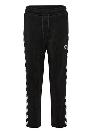 Jogging noir en polaires avec taille à cordon de serrage, deux poches latérales zippées et accents blancs rayés sur les côtés. Texture douce et coupe fuselée.