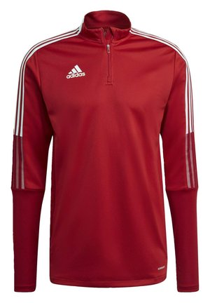 Roter sportlicher Pullover mit hohem Kragen, halbem Reißverschluss, weißem Adidas-Logo und weißen drei Streifen an den Schultern. Glatte Textur.
