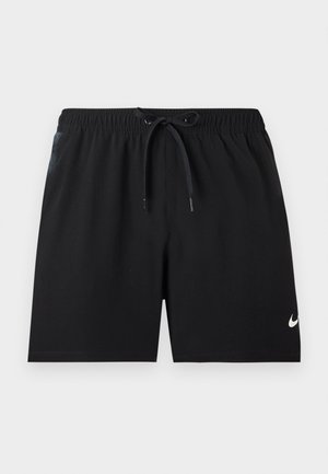 Mustad sportlikud lühikesed püksid elastse vöökohaga ja seotud kinnitusnööriga, alumisel paremal jalal väike valge Nike logo.