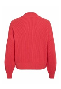 Soonikkoeline, liibuv kampsun erksas korallitoonis. Omadusteks pikad varrukad, lai krae ja lühendatud serv tekstuurse kudumisega.