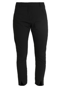 Pantalons noirs ajustés de longueur cheville avec passants de ceinture, poches latérales et ourlets fendus à l'avant.