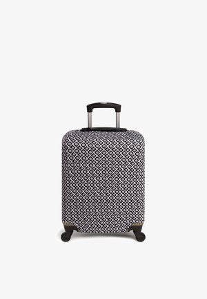 Walizka z twardą obudową o czarno-białym okrągłym wzorze, teleskopowa rączka, cztery kółka i gładka tekstura powierzchni.