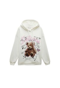 Crèmekleurige hoodie met een teddybeerafbeelding, handgeschreven tekst en krabbels. Zachte textuur met een ontspannen pasvorm en een capuchon met trekkoord.
