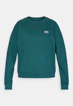 Teal crew-neck sweatshirt with raglan sleeves, ribbed cuffs, and hem, featuring a small multicolored logo on the left chest. Soft fabric texture.