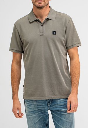 Grijze polo met een klassieke kraag en een klein zwart logo op de borst. Korte mouwen met een reguliere pasvorm.