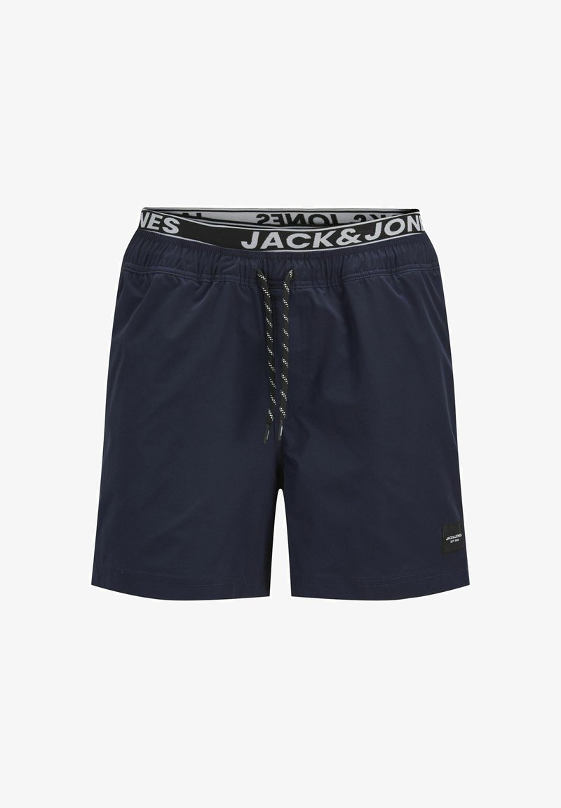 Námorné plavky vyrobené z ľahkej tkaniny. Majú elastický pás s logom a šnúrkou, bočné vrecká a minimalistický dizajn.