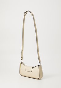 Cream leather shoulder bag with a structured shape, contrasting black trim, and an adjustable strap. Features a flap closure and silver hardware.