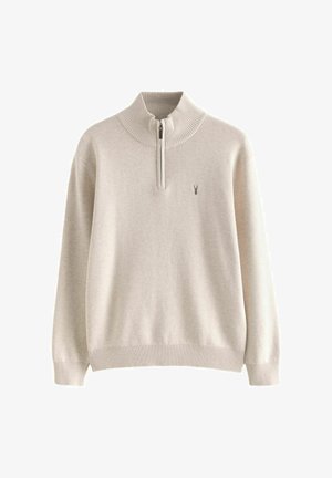 Világos bézs pulóver magas gallérral és félcipzárral, bordás mandzsettával és szegéllyel, puha kötött anyagból készült, kis logó részlettel.